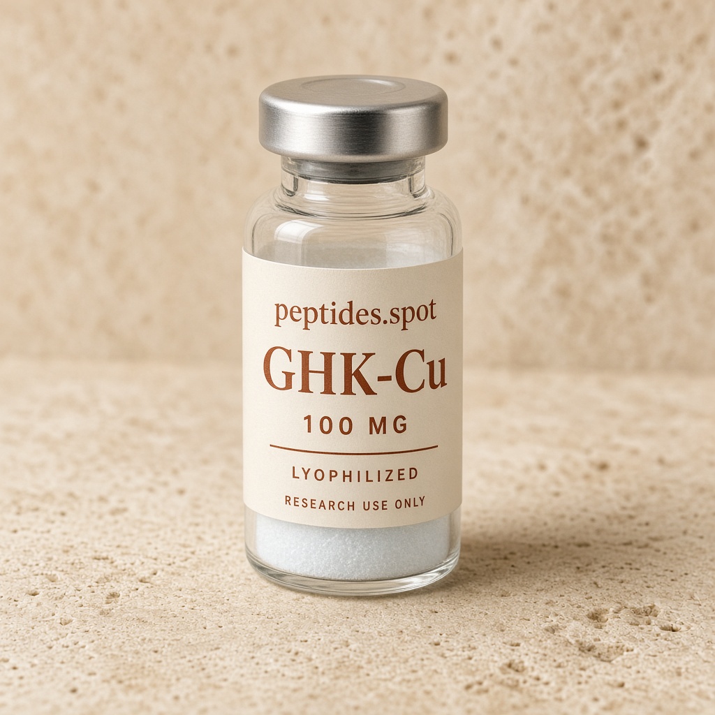 peptides.spot branded GHK-Cu 100 mg research vial with cream and rust label on warm stone.